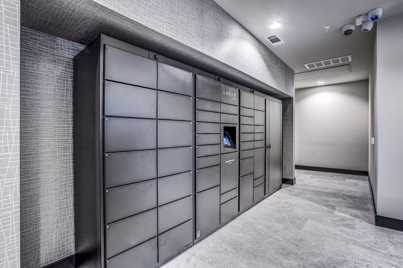 Secure parcel pickup lockers at Bluffs at Midway Hollow Apartments for convenient package retrieval