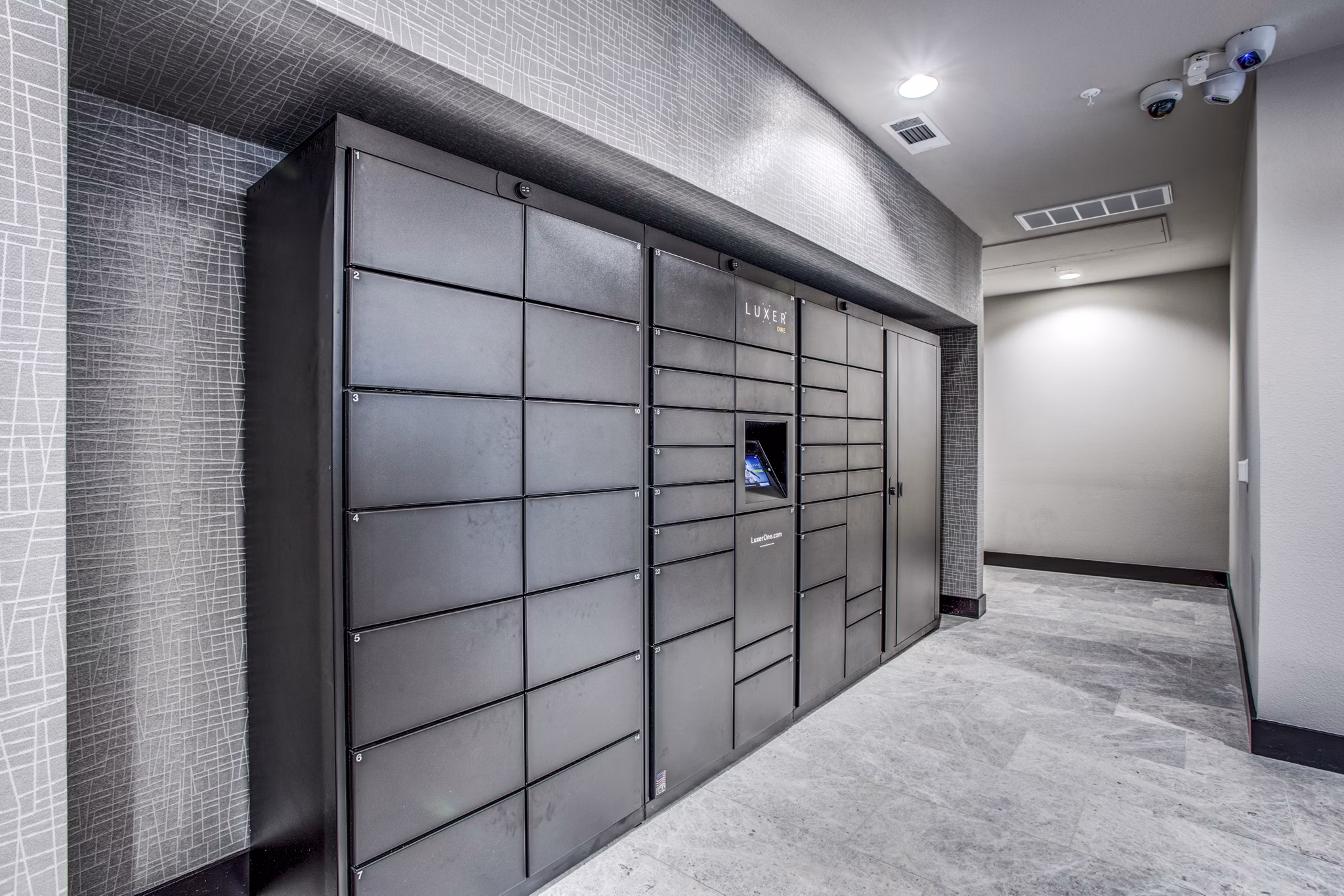 Secure parcel pickup lockers at Bluffs at Midway Hollow Apartments for convenient package retrieval