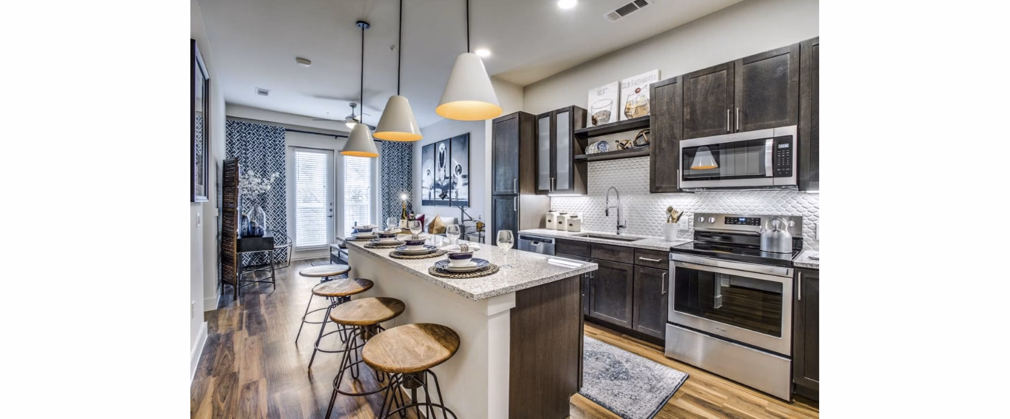 Modern kitchen with stainless steel appliances at Bluffs at Midway Hollow Apartments