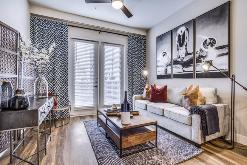 Spacious living room with natural light and modern decor at Bluffs at Midway Hollow Apartments