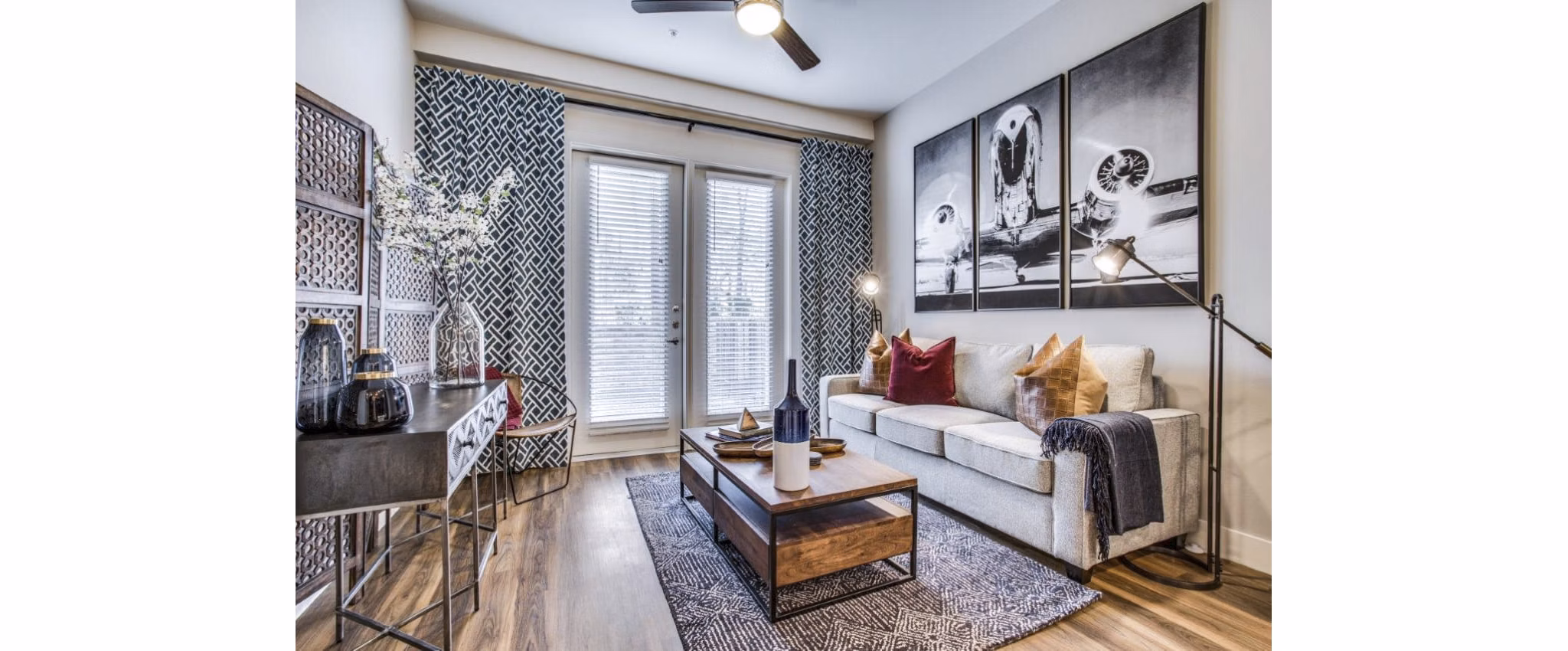 Spacious living room with natural light and modern decor at Bluffs at Midway Hollow Apartments