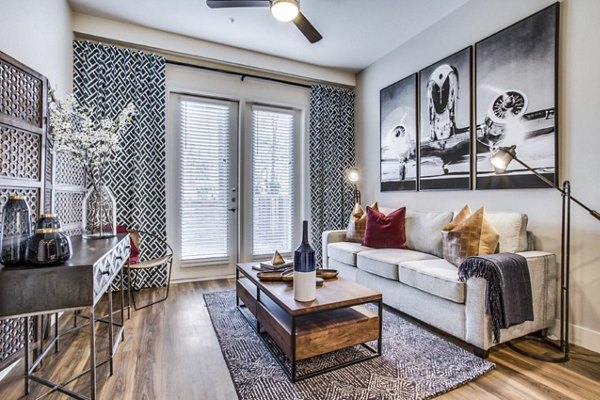 Spacious living room with natural light and modern decor at Bluffs at Midway Hollow Apartments