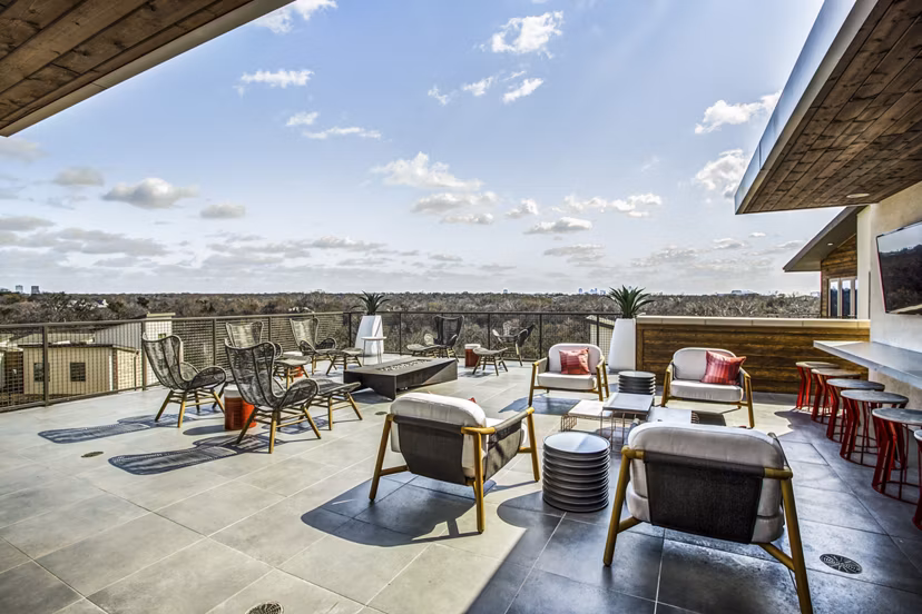 Cozy fire pit area on a balcony at Bluffs at Midway Hollow Apartments