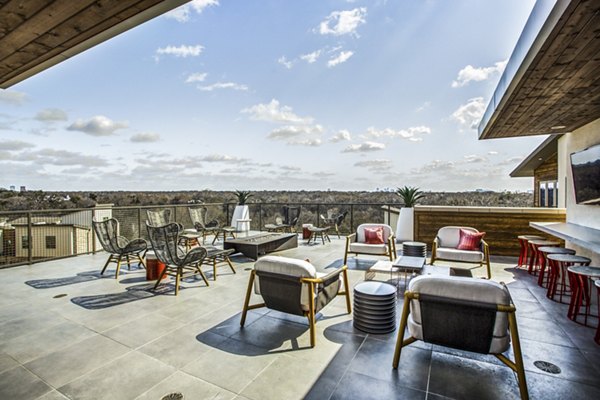 Cozy fire pit area on a balcony at Bluffs at Midway Hollow Apartments