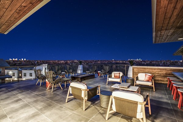 Cozy fire pit on spacious patio at Bluffs at Midway Hollow Apartments, ideal for relaxation and gatherings