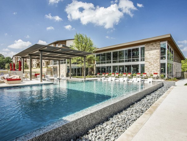 Inviting outdoor pool area at Bluffs at Midway Hollow Apartments, perfect for relaxation and leisure activities