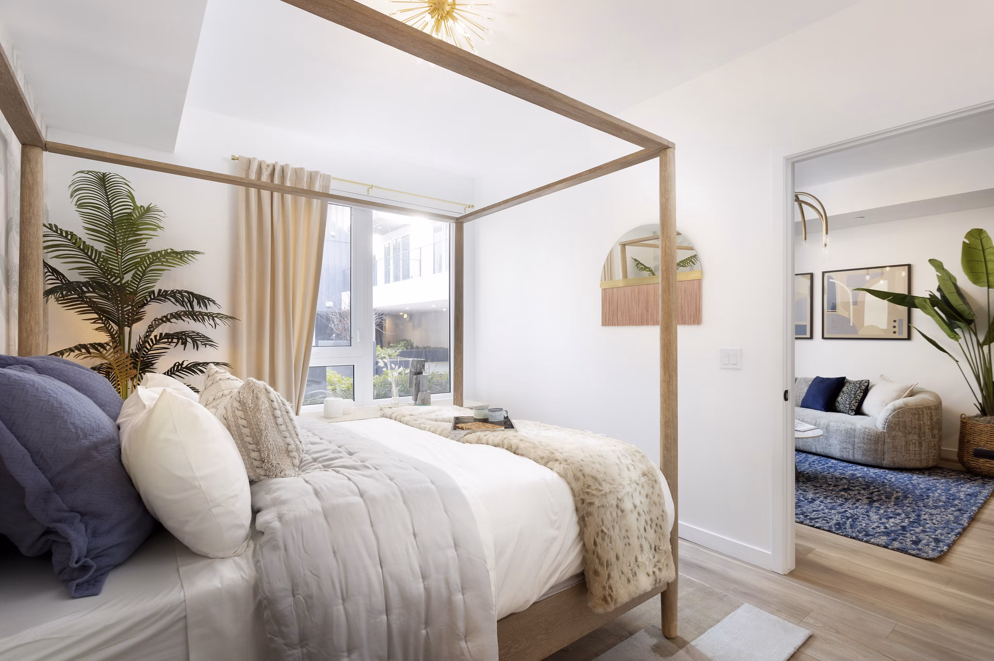 Elegant bedroom with modern decor at The Louise 4900 Apartments