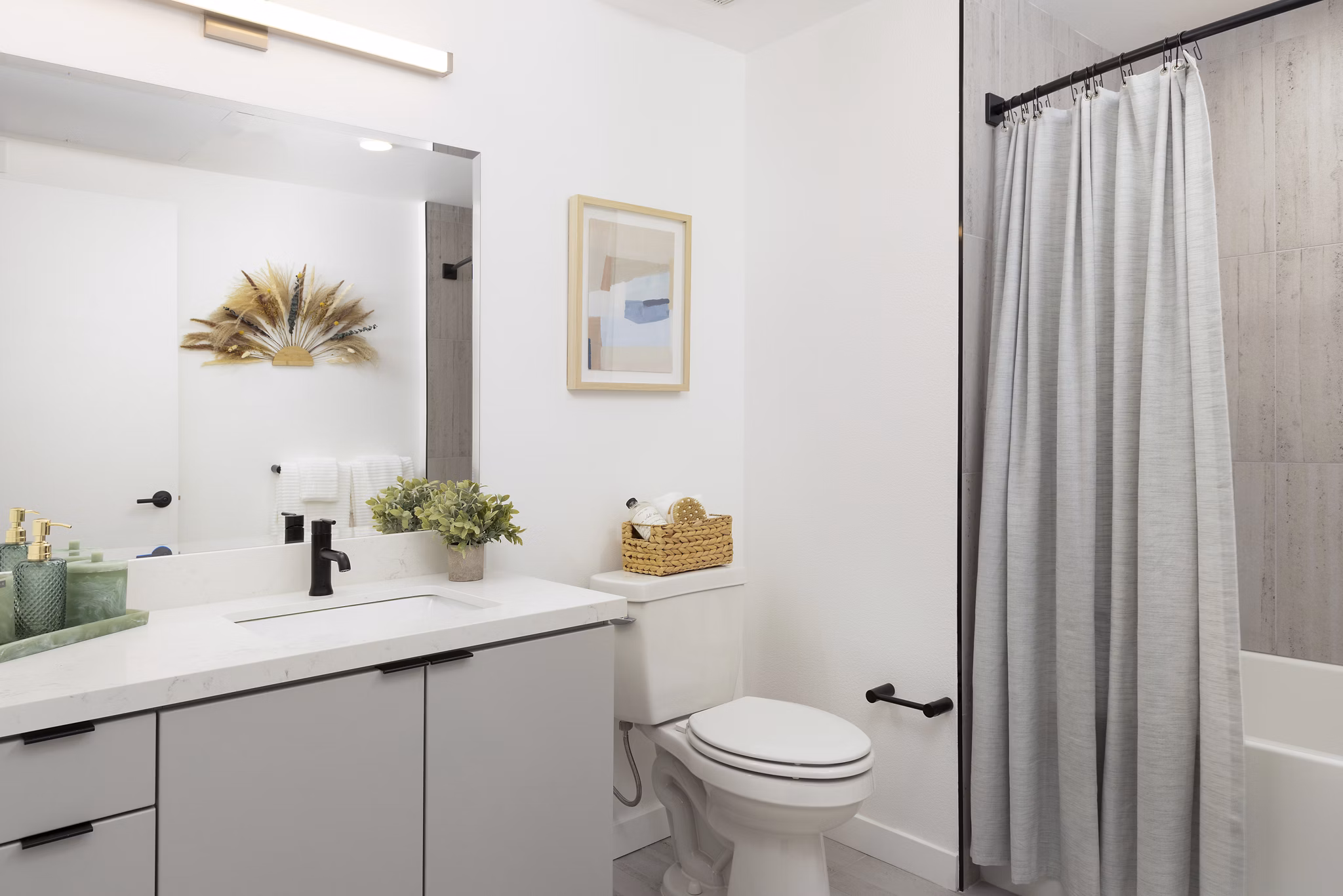 Modern bathroom with sleek fixtures at The Louise 4900 Apartments