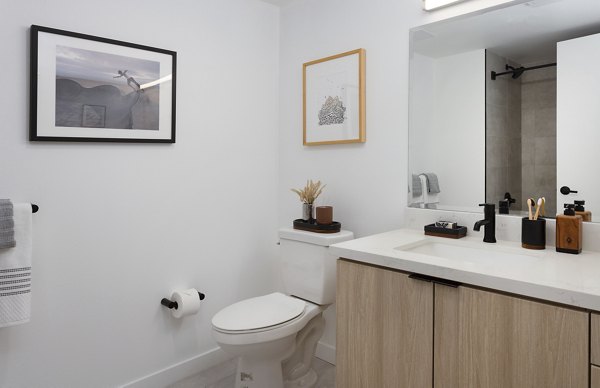 Modern bathroom with sleek fixtures at The Louise 4900 Apartments