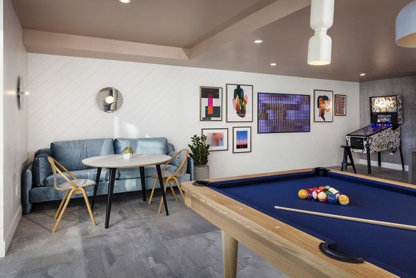 Clubhouse with modern design and seating areas at The Louise 4900 Apartments