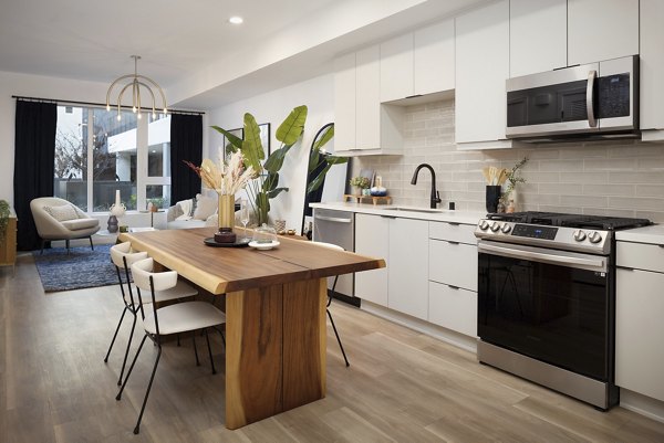 Modern kitchen featuring stainless steel appliances at The Louise 4900 Apartments in Greystar's luxury collection