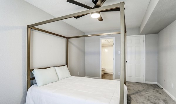 Cozy bedroom in The Lumiere Apartments with plush bedding and modern decor, perfect for luxury living