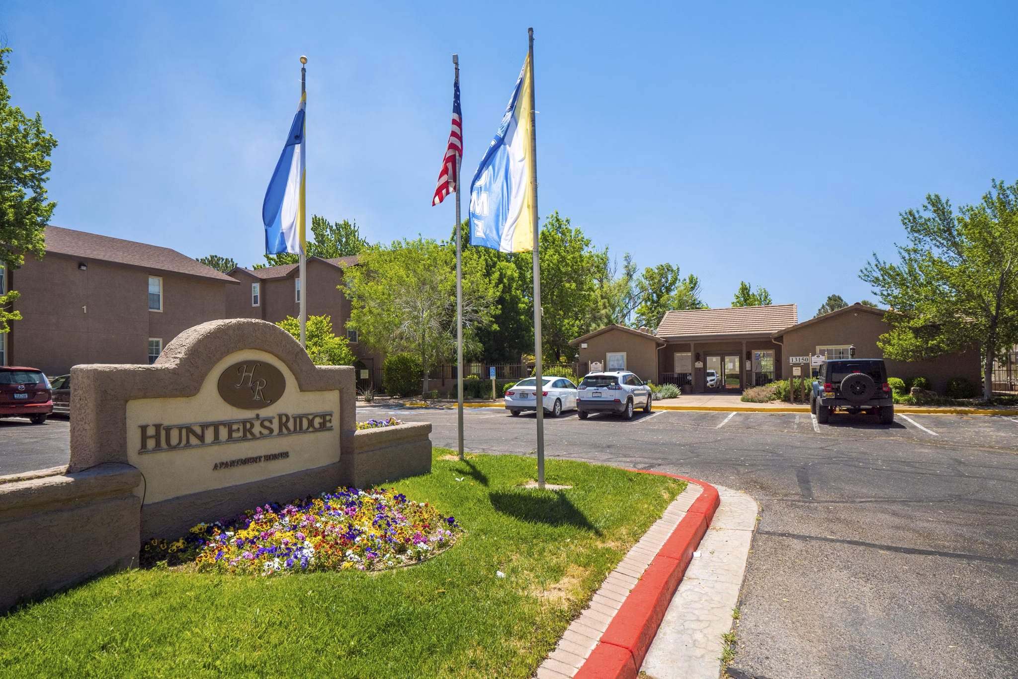Signage at Hunters Ridge Apartments showcasing modern luxury living amenities and style