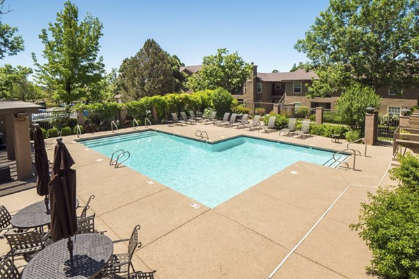 Resort-style pool with sun loungers at Hunters Ridge Apartments, a Greystar luxury community