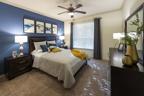 Cozy bedroom with modern furnishings at Regard at Med Center Apartments