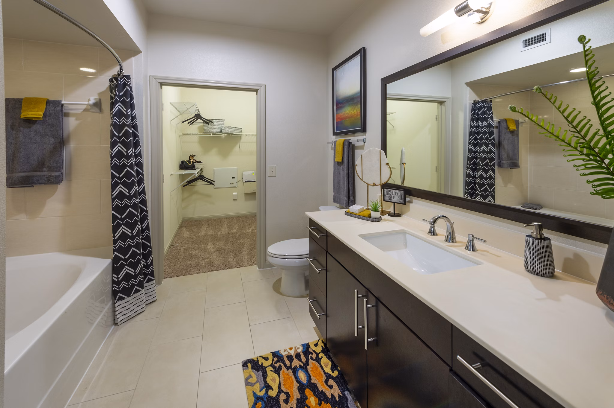 Elegant bathroom with marble countertops at Regard at Med Center Apartments, featuring modern fixtures and spacious design in Houston luxury living