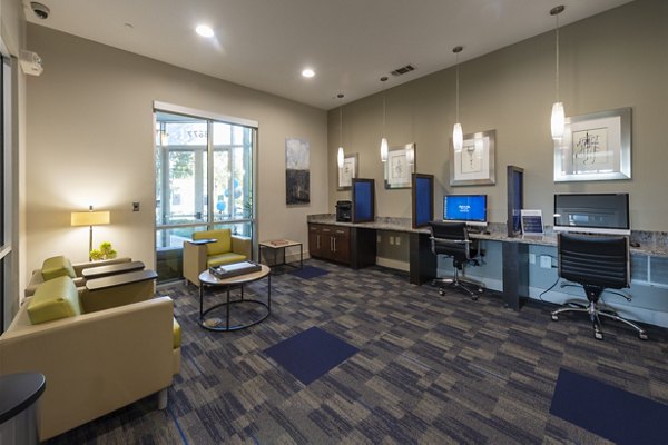 Clubhouse featuring modern seating and entertainment space at Regard at Med Center Apartments