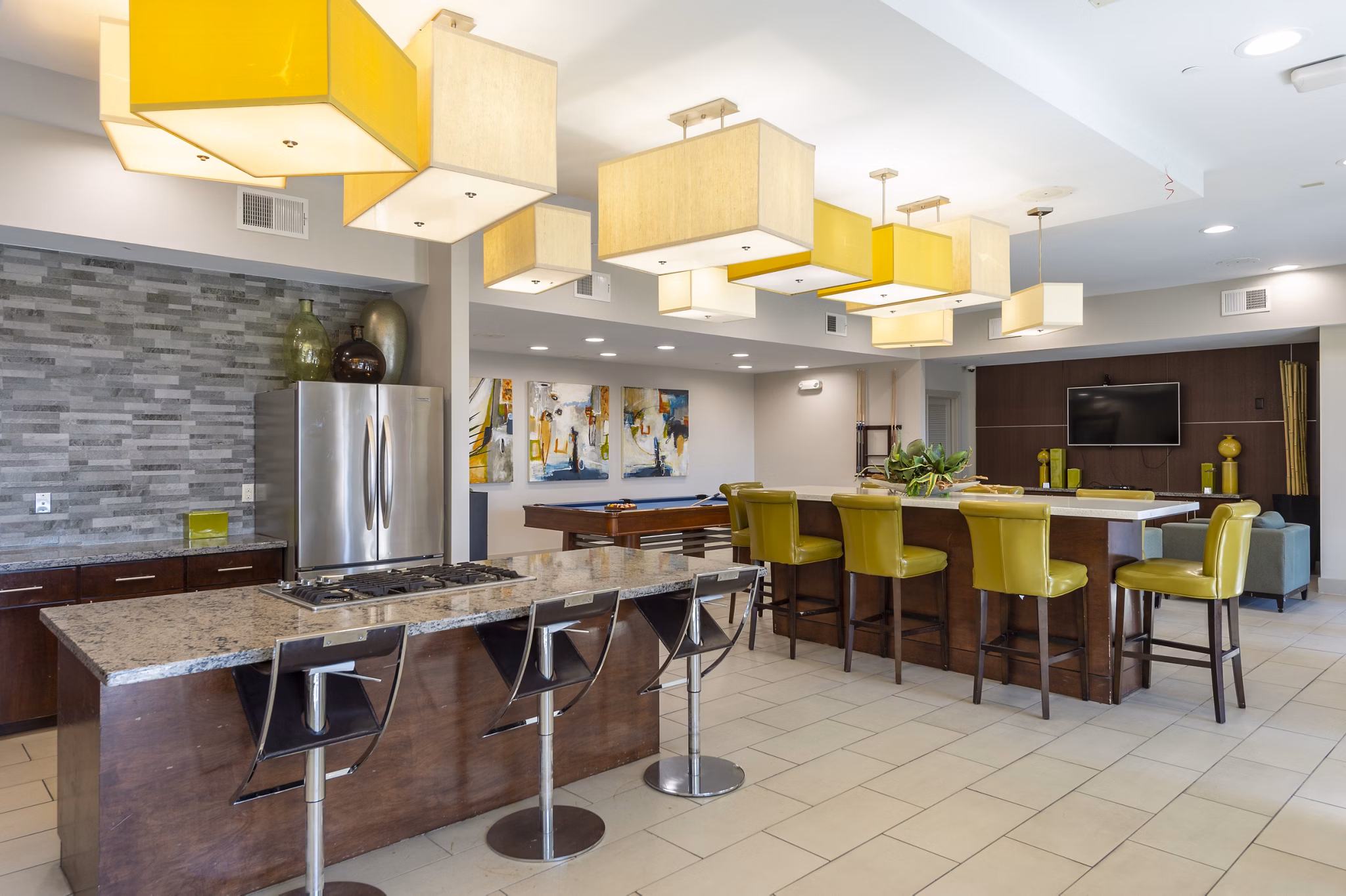 Clubhouse featuring modern lounge seating and billiards at Regard at Med Center Apartments