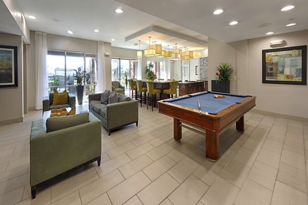 Clubhouse with modern design at Regard at Med Center Apartments, featuring spacious seating and entertainment areas