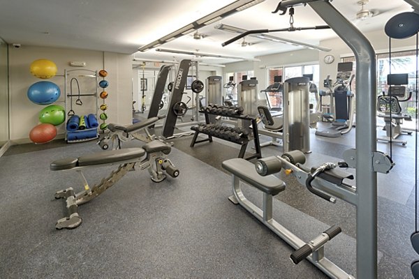 State-of-the-art fitness center at Regard at Med Center Apartments, featuring modern equipment and spacious workout areas for active living