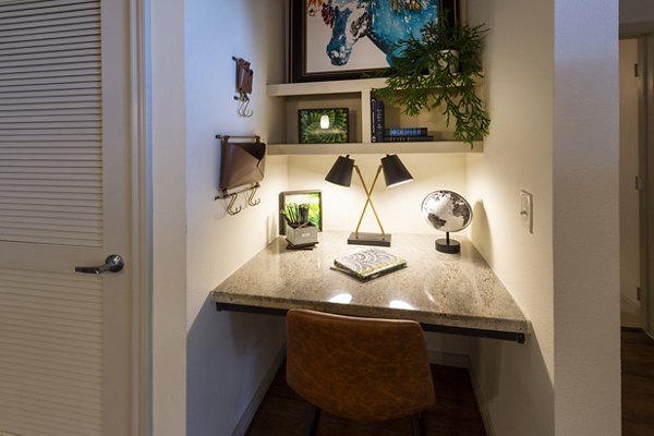 Modern kitchen with stainless steel appliances at Regard at Med Center Apartments