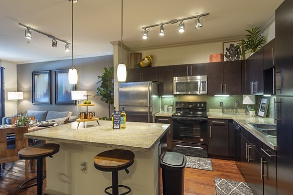 Modern kitchen with sleek appliances at Regard at Med Center Apartments