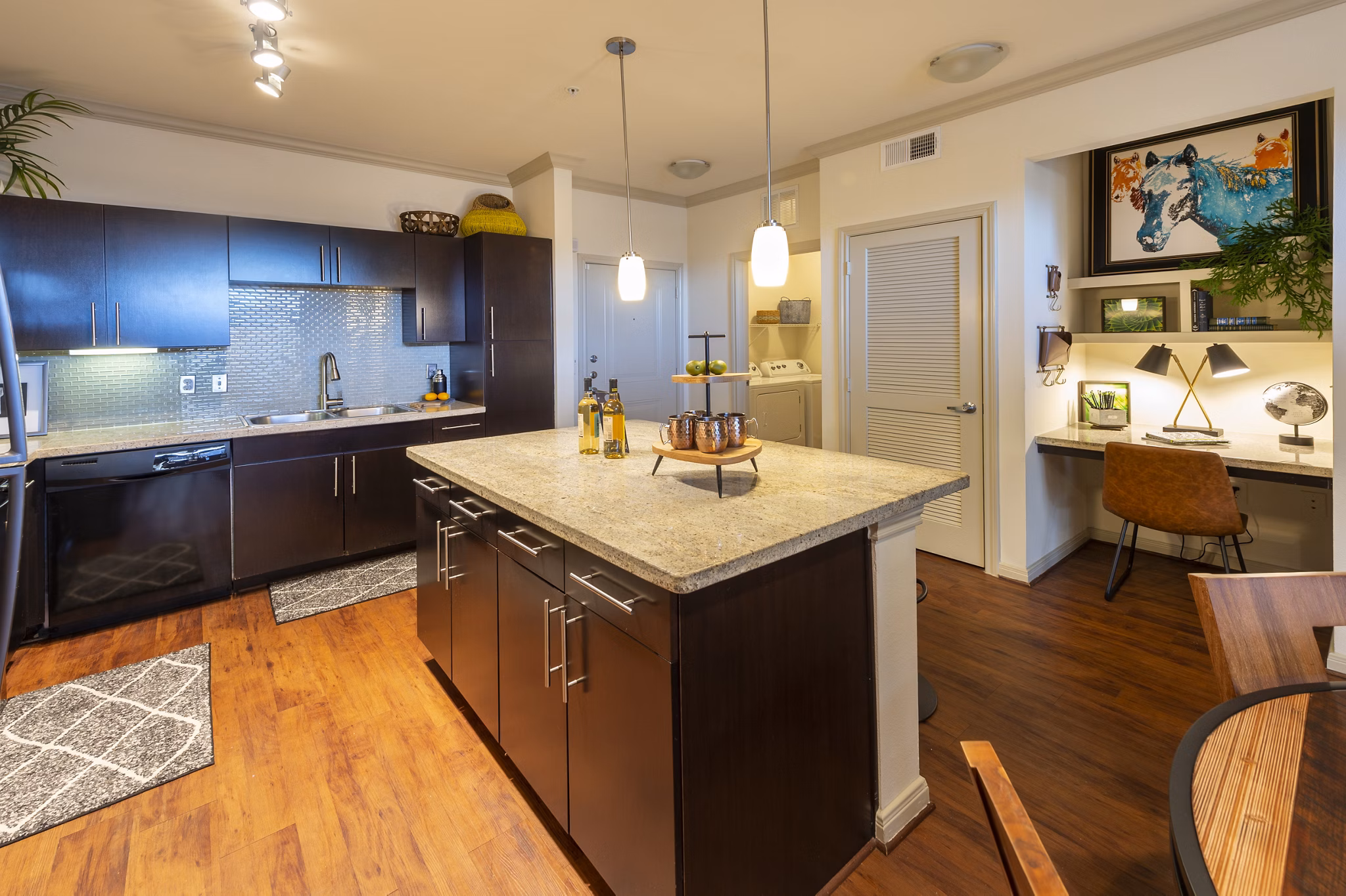 Kitchen featuring marble countertops and stainless steel appliances at Regard at Med Center Apartments