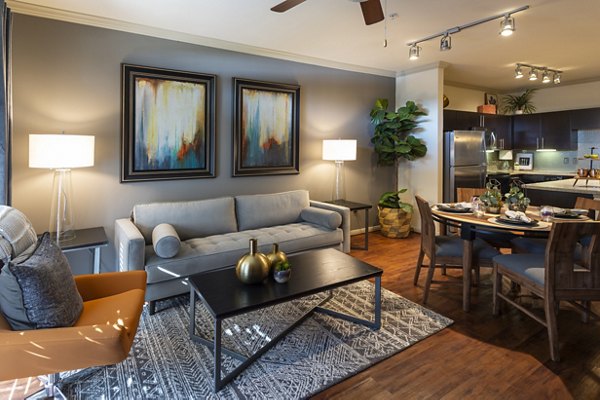 Living room with stylish decor and natural light at Regard at Med Center luxury apartments