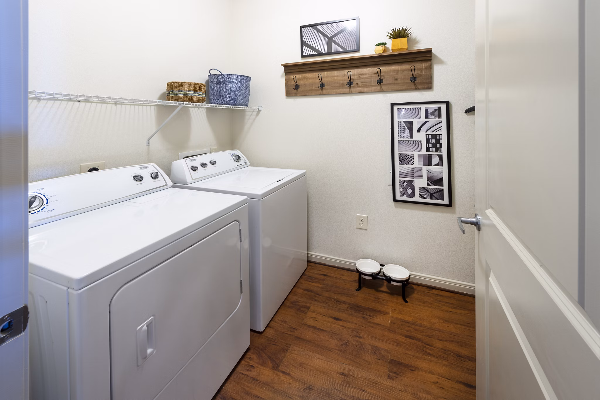 Laundry room with modern appliances at Regard at Med Center Apartments, offering convenience and style for residents
