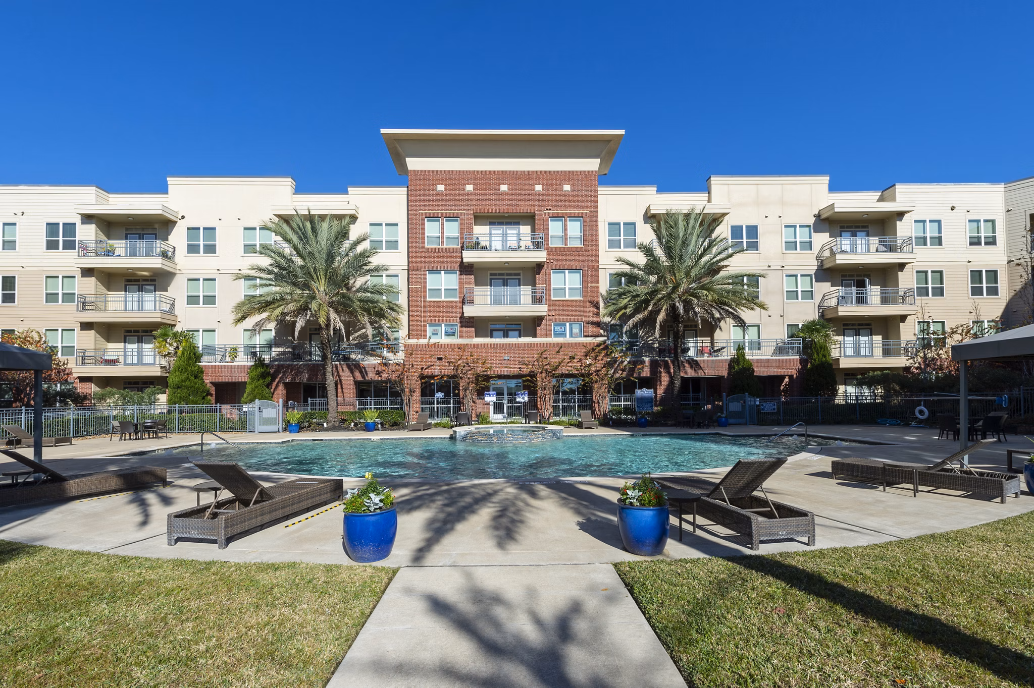 Rooftop pool with lounge seating at Regard at Med Center Apartments