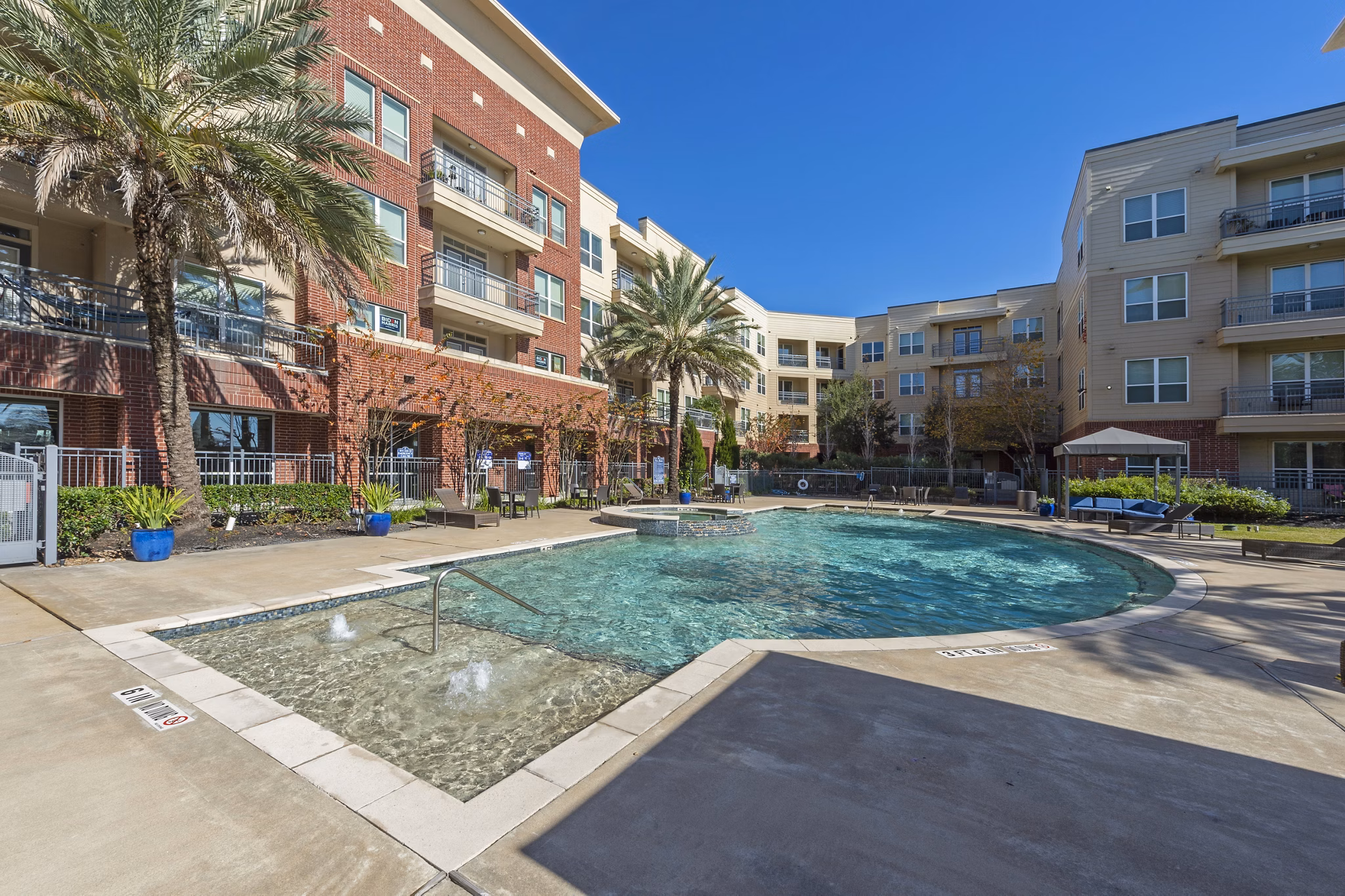 Luxurious pool at Regard at Med Center Apartments offering relaxation and stunning outdoor views
