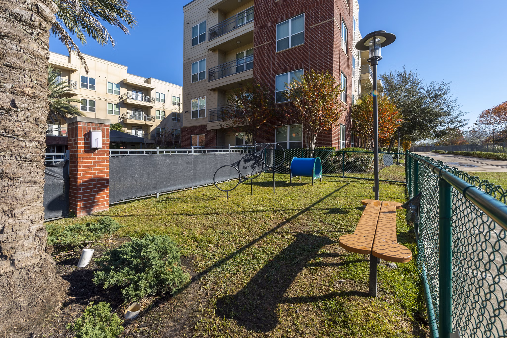 Outdoor recreation area featuring lush gardens at Regard at Med Center Apartments