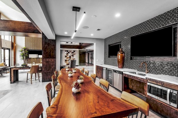 Clubhouse featuring modern design and seating at Tribute at the Rim Apartments in San Antonio