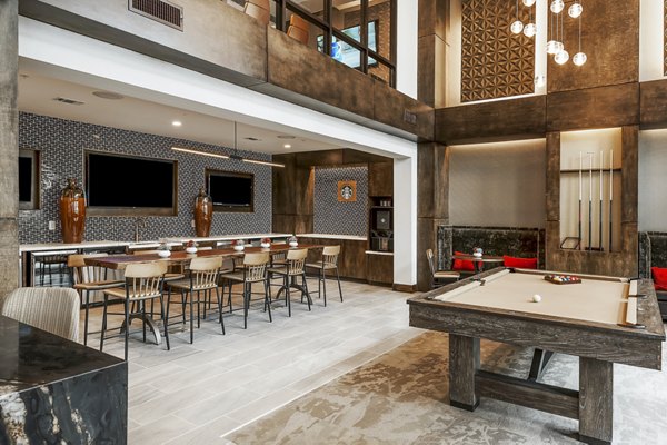 Elegant clubhouse with modern decor at Tribute at the Rim Apartments, offering residents luxury living spaces in a prime location
