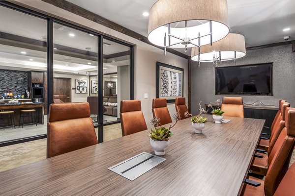 Clubhouse featuring modern design and comfortable seating at Tribute at the Rim Apartments