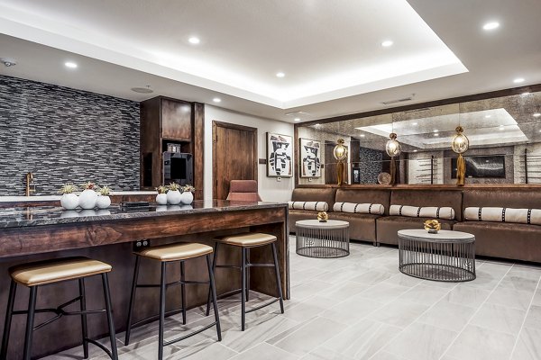 Expansive clubhouse with modern seating and dÃ©cor at Tribute at the Rim Apartments, perfect for community gatherings
