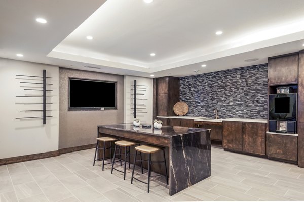 Modern clubhouse featuring stylish seating and entertainment options at Tribute at the Rim Apartments in a Greystar luxury community