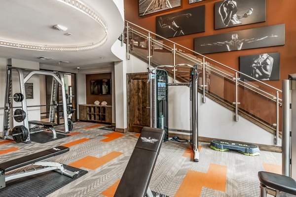 State-of-the-art fitness center at Tribute at the Rim Apartments, featuring modern equipment and spacious workout areas