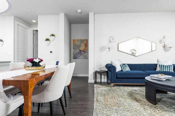 Modern living room with luxurious furnishings at Tribute at the Rim Apartments, offering contemporary style and comfort in a premier location