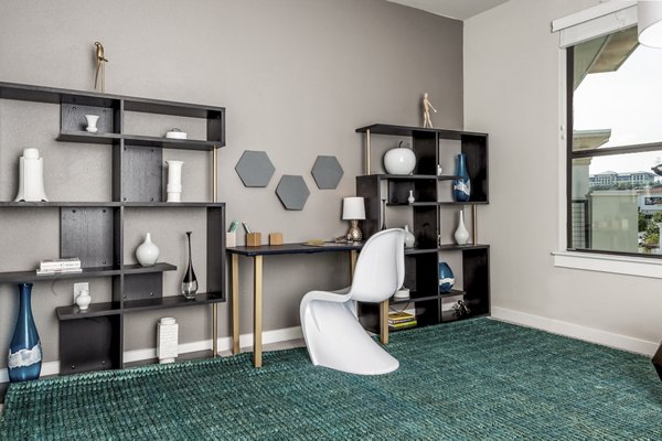 Living room and home office with modern decor at Tribute at the Rim Apartments Ideal space for productivity and relaxation