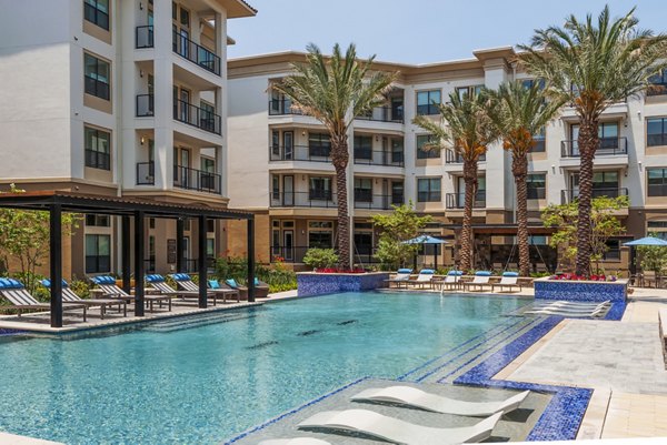 Saltwater pool at Tribute at the Rim Apartments offering luxurious relaxation and scenic views in a vibrant San Antonio community