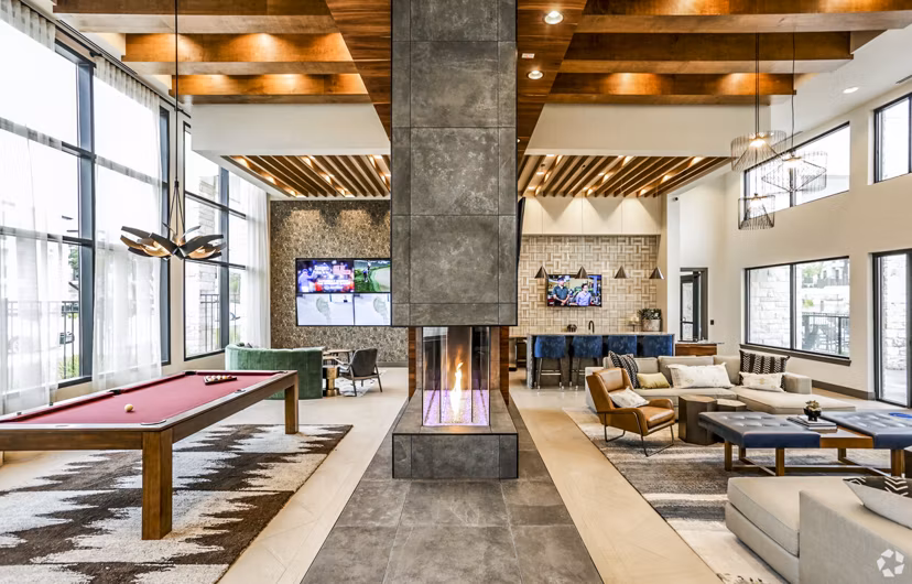 Clubhouse featuring modern decor and community seating at TruNorth at Bulverde Apartments, a Greystar luxury apartment community