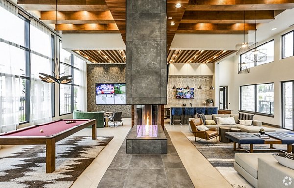 Clubhouse featuring modern decor and community seating at TruNorth at Bulverde Apartments, a Greystar luxury apartment community