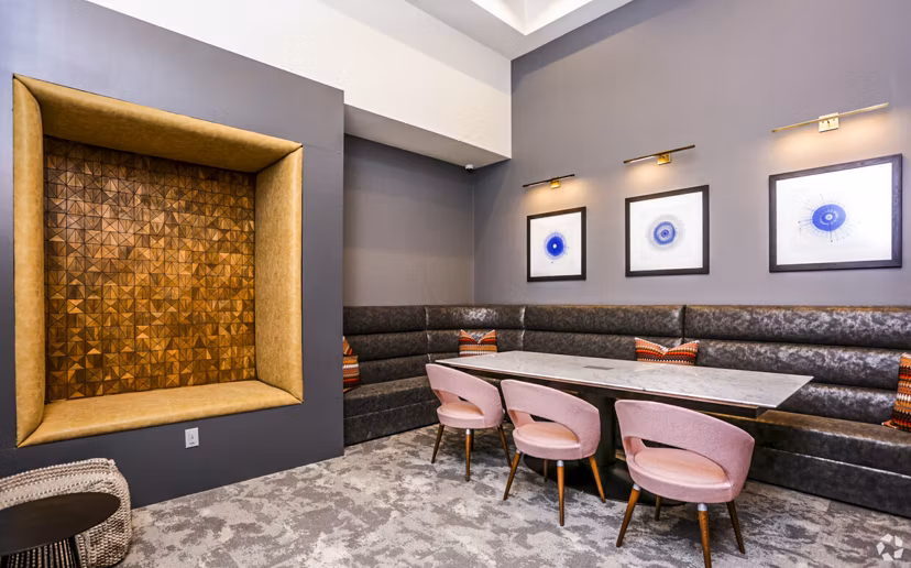 Modern clubhouse with stylish seating and pool table at TruNorth at Bulverde Apartments
