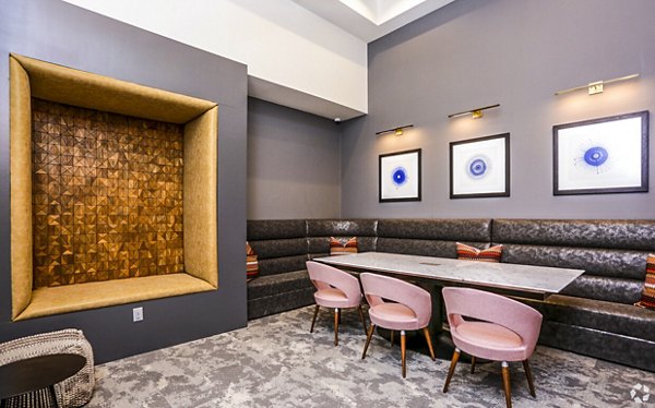 Modern clubhouse with stylish seating and pool table at TruNorth at Bulverde Apartments