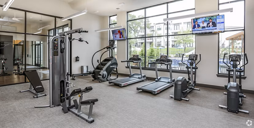 Modern fitness center with state-of-the-art equipment at TruNorth at Bulverde Apartments