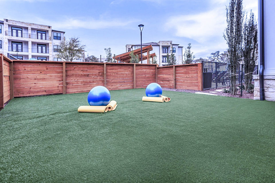Recreational area with green spaces at TruNorth at Bulverde Apartments