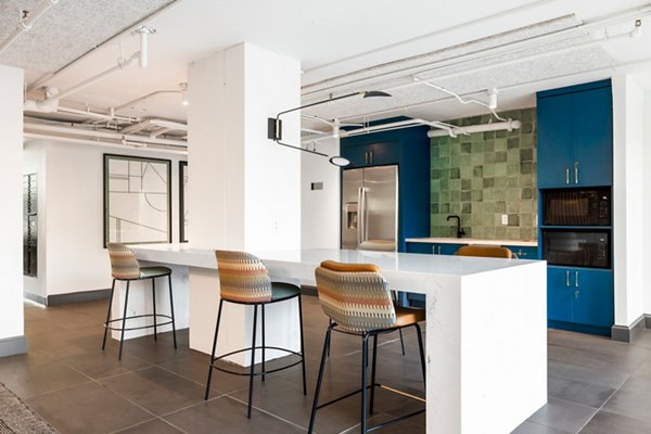Spacious clubhouse with modern decor at The Accolade on Chestnut Apartments, ideal for luxury community gatherings and events