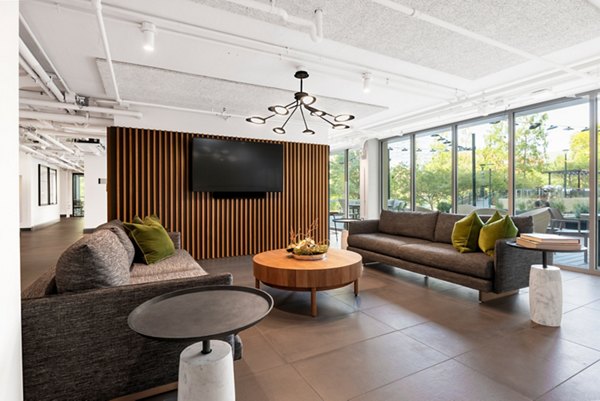 Clubhouse featuring modern design elements at The Accolade on Chestnut Apartments, a luxury community by Greystar