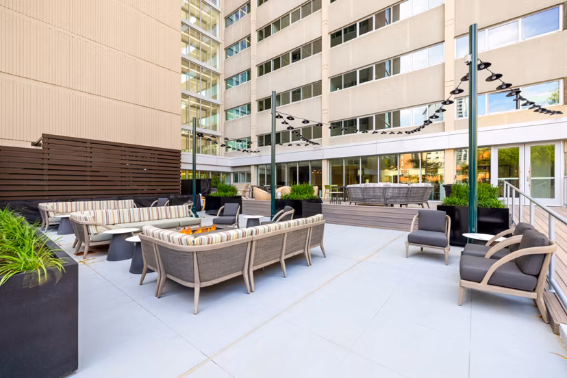 Stylish rooftop deck with city views at The Accolade on Chestnut Apartments, ideal for relaxation and gatherings
